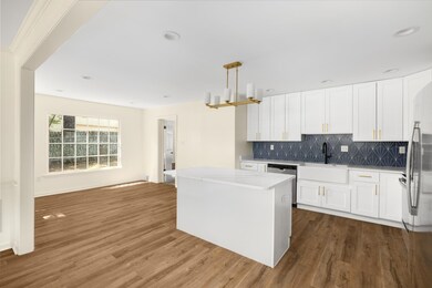 Kitchen featuring sink, hardwood / wood-style floo
