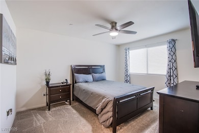 Bedroom featuring carpet, baseboards, and ceiling