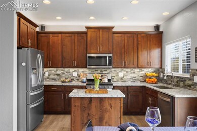 Kitchen featuring stainless steel appliances, tast