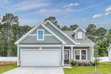 Craftsman house featuring a garage and a front yar