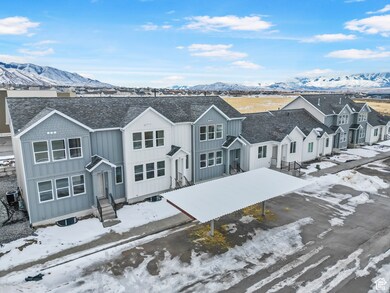 View of front facade featuring central AC unit, board and batten siding, entry steps, and a residential view