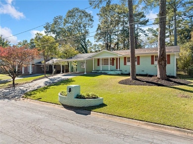 Single story home featuring a front yard