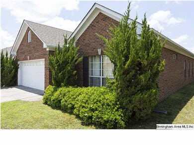 Front side view. All brick with garage