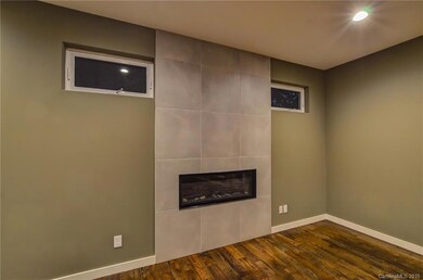 Modern fireplace with gas logs available as upgrade