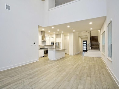 Unfurnished living room featuring light wood-styl