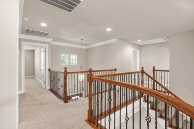 Corridor with an upstairs landing, carpet floorin