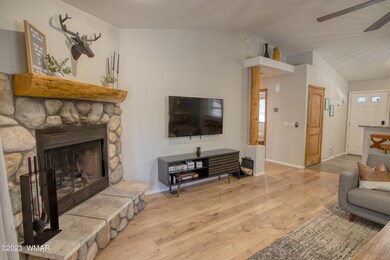 Wood burning fireplace view to bedrooms