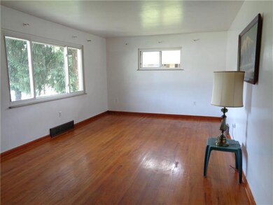 Large, bright living room with fantastic hardwood 