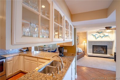 Glass upper cabinets add a touch of sophistication