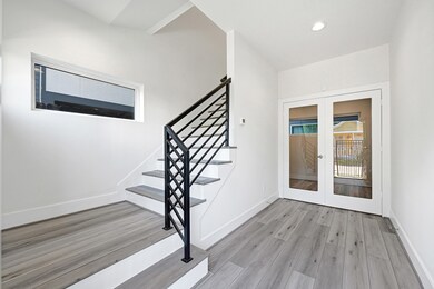 Foyer with Staircase and Bedroom/Studio View