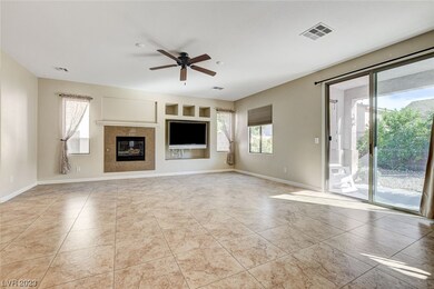 Tiled family room with fireplace.