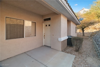 Doorway to property featuring central air conditio