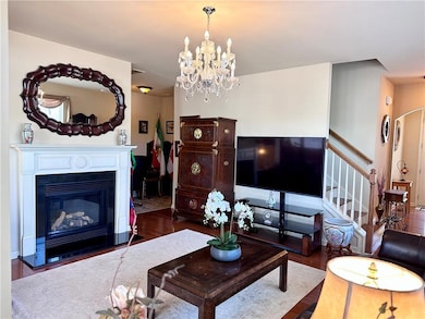 Living area with a glass covered fireplace