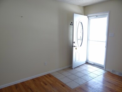 tiled entry with storm door