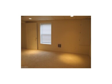Third bedroom in basement with full window.