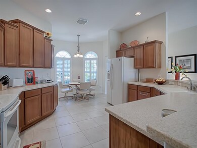 LIGHT CHERRY CABINETS WITH TOP CROWN TRIM AND CORI