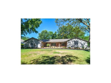 Front of home faces east, with a circle drive