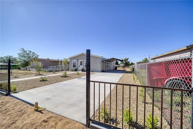 View of front of house with driveway and a detache
