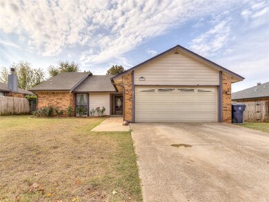 Ranch-style home featuring a garage and a front la