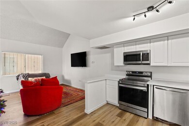 Kitchen featuring stainless steel appliances, ligh