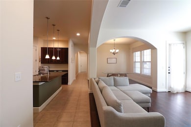 Living room featuring a chandelier, recessed light