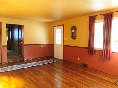 Living room with hardwood flooring.