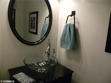 Other - Half Bath on first floor features vanity w