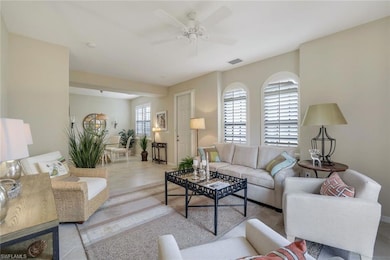 Living room featuring light tile patterned floors,
