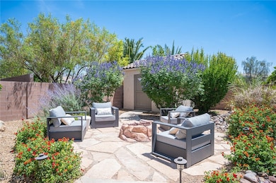 Fenced backyard featuring a patio area and an outd