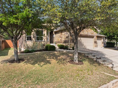 Obstructed view of property with stone siding, a 