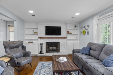 Welcoming living area with large picture window, r