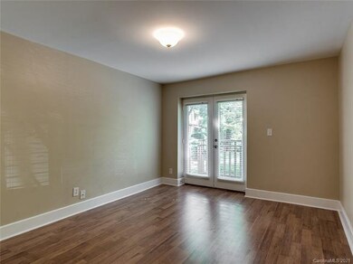 Living room with French doors to balcony.