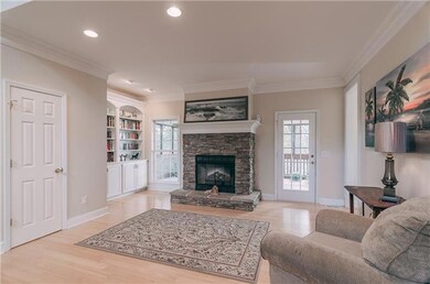 The Living Room also offers an Electric Fireplace and Built-In Shelving.