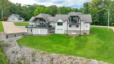 Back of property featuring cooling unit and a yard