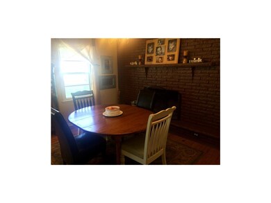 Dining Room with wood burning fireplace.