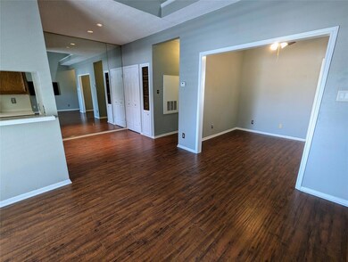 Empty room featuring dark wood-style flooring and