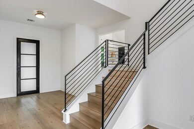 Entrance foyer with hardwood / wood-style floorin