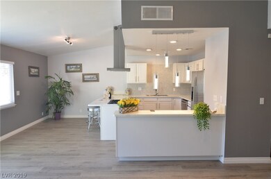 OPEN FLOOR. FAMILY ROOM LOOKING AT OPEN KITCHEN AN