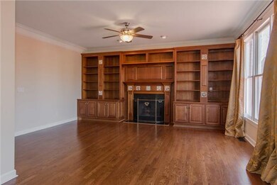 Beautiful Den with Built-In Bookcase, Ceiling Fan,