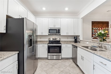 Kitchen featuring a sink, stainless steel applianc