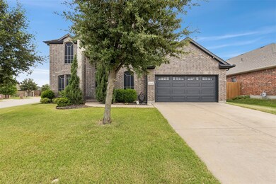 View of front of house featuring a garage and a fr
