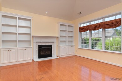 Living room featuring built in cabinets