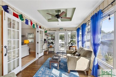 Light and bright sunroom with large windows and he