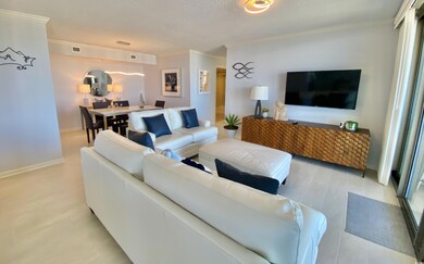 Living room featuring a textured ceiling, light ha