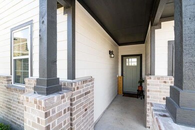 Property entrance with covered porch