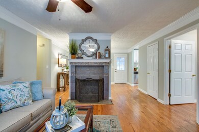 Cozy wood fireplace with a slate tile surround.. the perfect setting for your gatherings