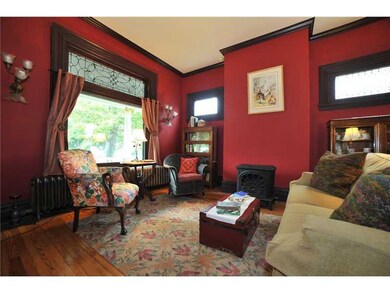 Living Room. Hardwood floors, original leaded glas