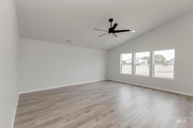Empty room featuring light wood-style flooring, lofted ceiling, recessed lighting, and ceiling fan
