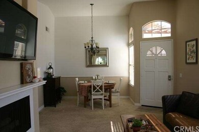 View of dining area with chair rails and designer paint & light fixture