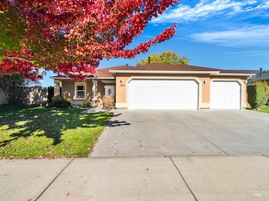 Single story home with stucco siding, concrete driveway, an attached garage, and a shingled roof